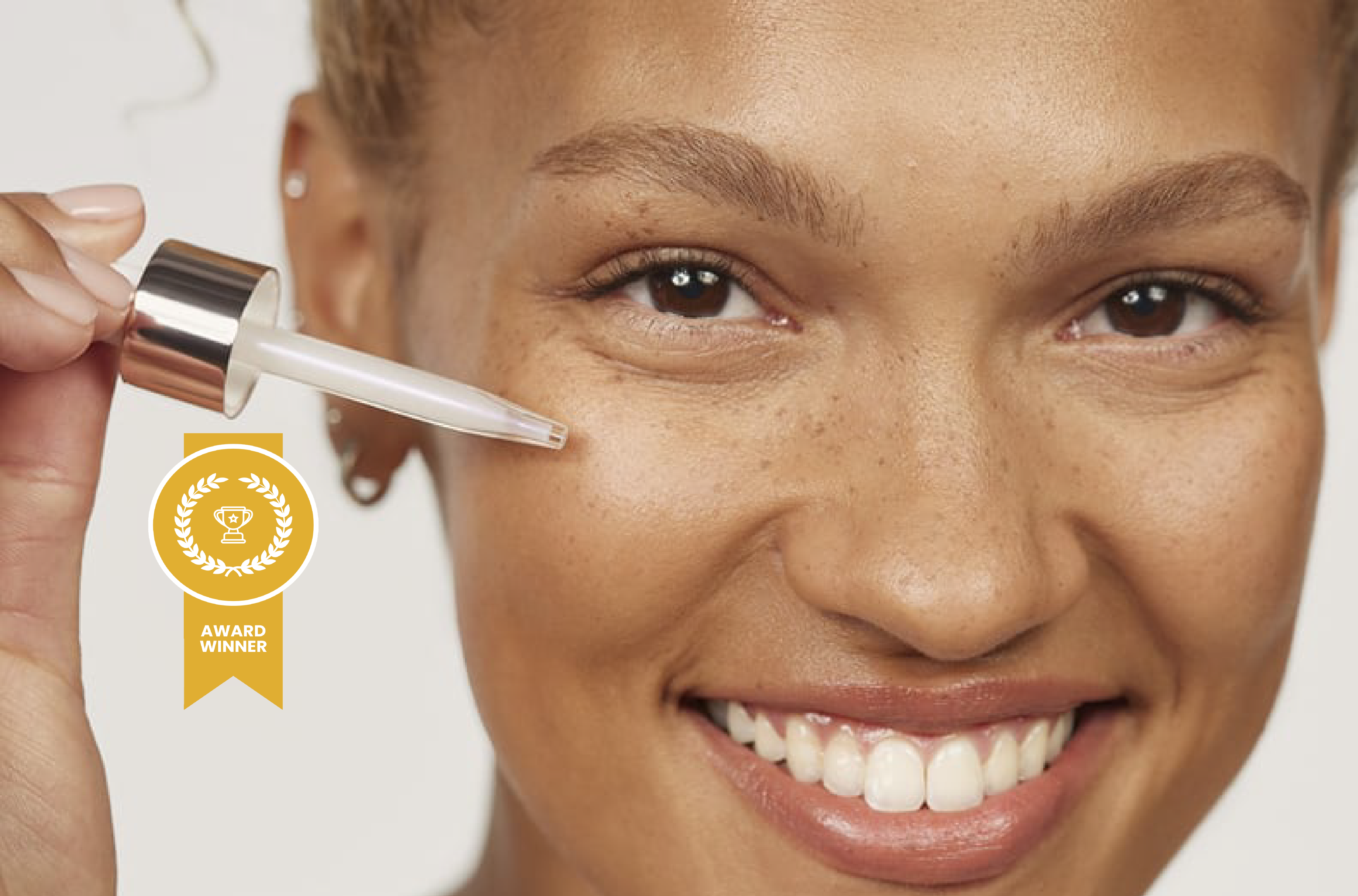Woman applying Olay Super Serum to face with an award winner badge overlayed